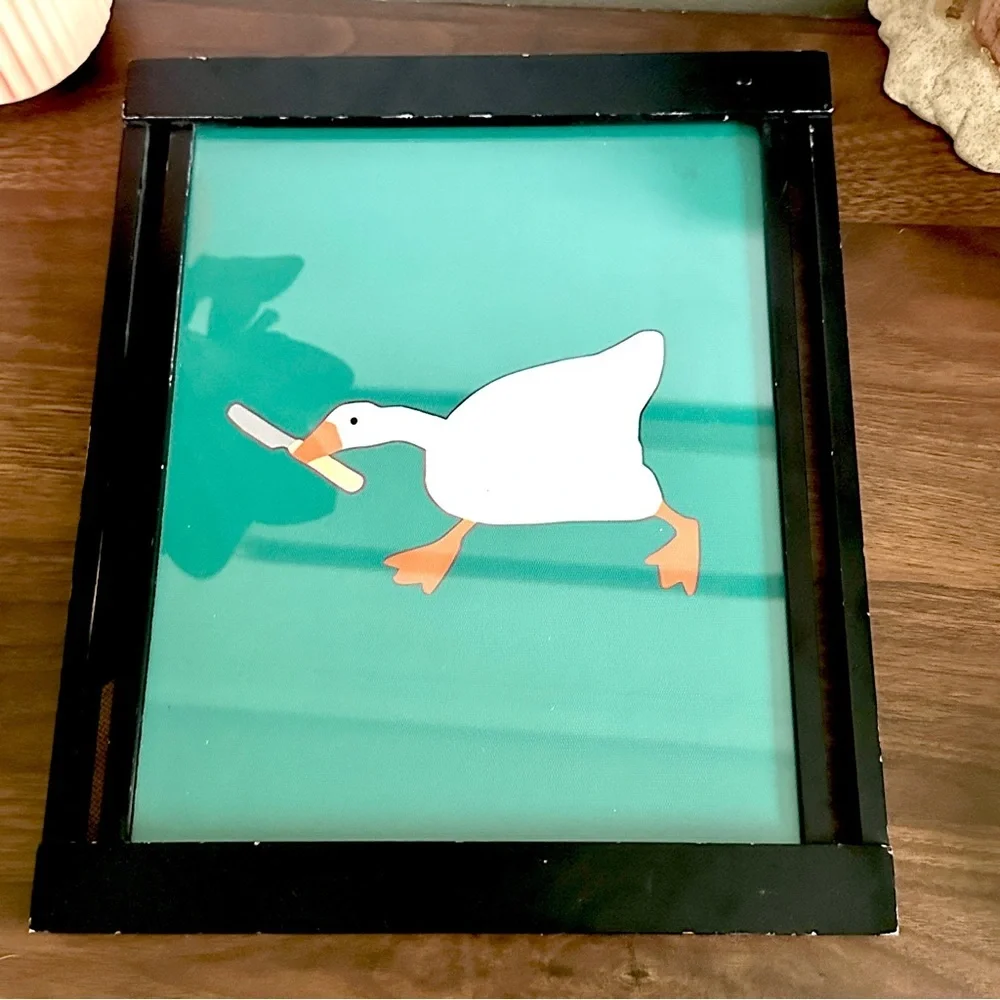 Silly Goose with a Butter Knife Green Canvas Print Black Framed Quirky Wall Art
